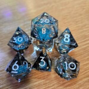 Golden Leaf liquid core dice with blue glitter, gold flecks and silver numbers